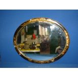 A black ebony oriental mirror, some of the frame A/F. 22" x 18".