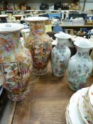 Two pairs of oriental Vases, one pair 12" tall and the other 9 1/2" tall.