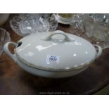 A large Limoges white tureen with lid.