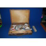 A 1930's artist's box of oil paints, two palette knives, small ceramic palettes, etc.