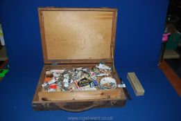 A 1930's artist's box of oil paints, two palette knives, small ceramic palettes, etc.