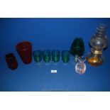A quantity of glass to include oil lamp, four green glasses, red vases, etc.