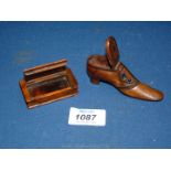 A treen walnut shoe shaped snuff box with opening lid and pique decoration to the sole and upper,