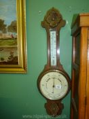 A 1930's wooden barometer.