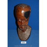 A carved African bust of a gent,