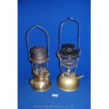 A brass storm Tilly lamp, 13'' tall plus a Hipolito brass paraffin lamp,