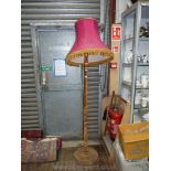 A most unusual Standard Lamp bound with brown velvet and complete with tasselled pink shade