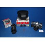 A Pentax K1000 35mm SLR Camera with Pentax 50mm f/2 SMC Lens, a Tokina 80-200mm f/4.