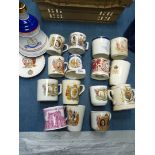 A quantity of commemorative mugs,