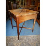 A circa 1900 Mahogany envelope Card Table standing on turned legs with cross stretcher,