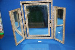 A triple, free standing dressing table Mirror having hinged central mirror,