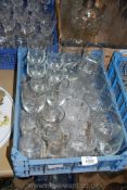 A quantity of mixed glasses including plain wine glasses, cut glass whisky tumblers etc.