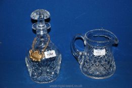 A Webb Corbett decanter and unmarked cut glass water Jug