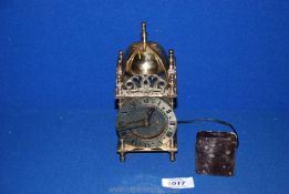 A Smiths battery mantle clock in brass with domed top and gallery,