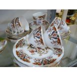 A Colclough part Teaset, pattern no. 8525, teacups and saucers, dessert plates and pudding bowls.
