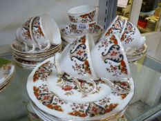 A Colclough part Teaset, pattern no. 8525, teacups and saucers, dessert plates and pudding bowls.