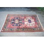 A bordered patterned and fringed Rug with contrasting gulls,