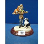 A Border Fine Arts figure of a Scarecrow 'Scallywags' and Collie dog signed Anne Wall.