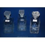 A pair of matching square glass Decanters plus another square Decanter engraved 'to Ernie from the