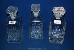 A pair of matching square glass Decanters plus another square Decanter engraved 'to Ernie from the