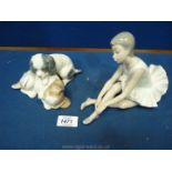 A German Nao figure of a ballet dancer and a pair of dogs sleeping.