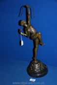 A Bronze sculpture of Diana, the Huntress, on a stone base, signed Pierre Le Faguays,