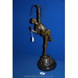 A Bronze sculpture of Diana, the Huntress, on a stone base, signed Pierre Le Faguays,