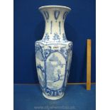 A large modern blue and white Oriental Vase with panels decorated with birds, trees, butterflies,