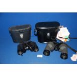 A pair of cased Boots Pacer 8 x 30 mm Binoculars together with a cased pair of Swift 10 x 40 mm