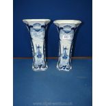A pair of Delft Holland blue & white trumpet vases with seaside views. 12 " tall.
