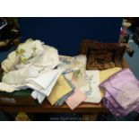 A good quantity of linen including embroidered and crocheted tablecloths,