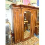 A Victorian Mahogany break front Wardrobe having unusual internal arrangement with a flight of