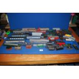 A quantity of 'OO' gauge coaches, wagons, locomotives, tenders etc, in ''play worn'' condition.