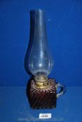 An Oil Lamp with cranberry oil reservoir,