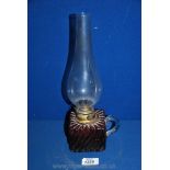 An Oil Lamp with cranberry oil reservoir,