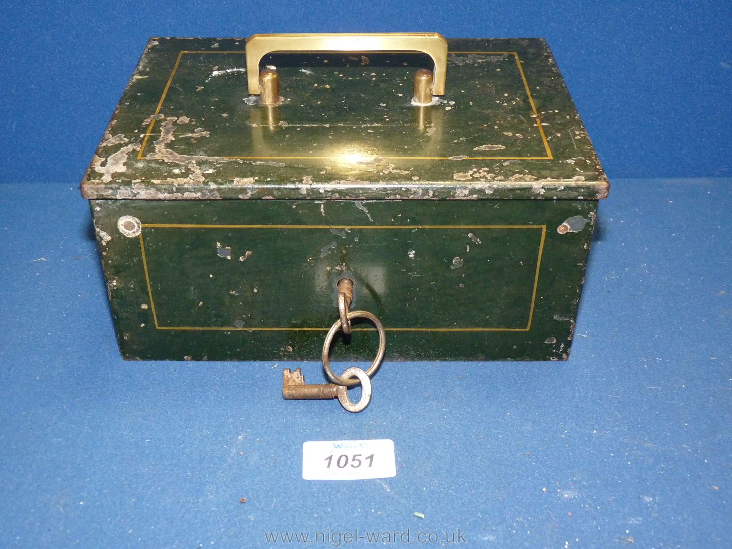 An Edwardian tin cash box with alarm, keys present, 8 1/2" long x 6" wide x 4" deep.