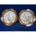 A pair of low Kutani footed Bowls decorated with birds,