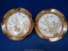 A pair of low Kutani footed Bowls decorated with birds,