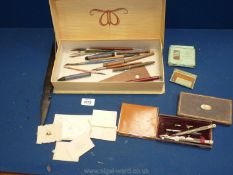 A Waverley box and contents including pens, crayons, letter openers, boxed geometry set,