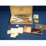 A Waverley box and contents including pens, crayons, letter openers, boxed geometry set,