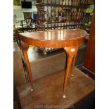 A pie crust edged Mahogany demi-lune Side Table standing on cabriole legs (edge a/f),