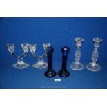 Three pairs of candlesticks, blue glass,