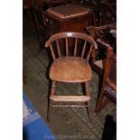 An appealing mixed woods circa 1900 child's High Chair having turned stretchers and legs and back