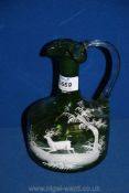 A Mary Gregory green glass jug, 8" tall.