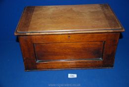 A wooden Box with hinged lid, lacking interior trays,