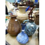 Four large vases, one being blue with handle made in Austria, two pottery vases and a blue vase.