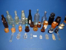 A quantity of old clear and brown glass Bottles including Lea & Perrins, Merthyr Bottling Company,