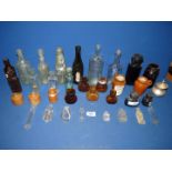 A quantity of old clear and brown glass Bottles including Lea & Perrins, Merthyr Bottling Company,