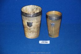 Two Horn beakers with silver rims and shields with initials, 4 1/2'' tall, and 3 1/2'' tall,