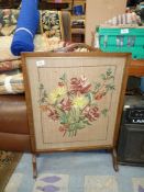 An embroidered fire screen. 32 1/2" x 22".